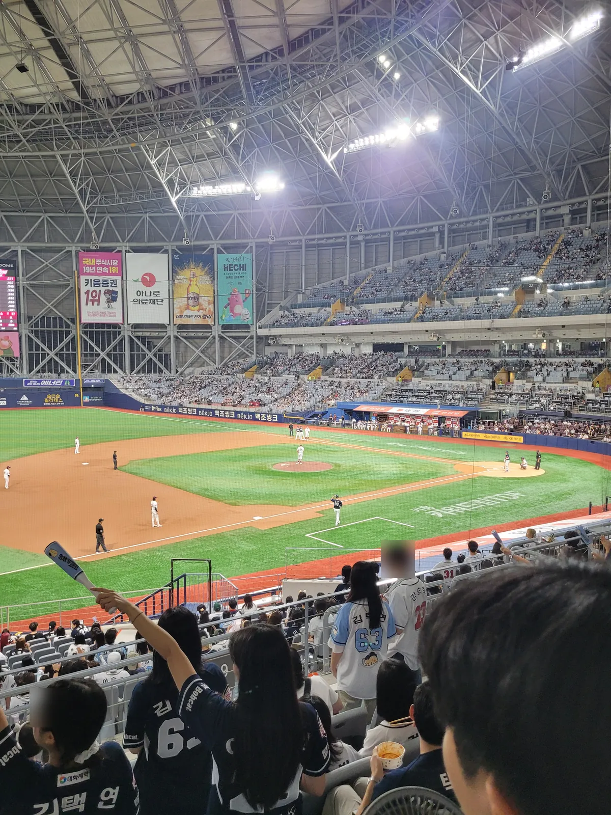 Steel roof trusses and floodlights above the field at Gocheok Sky Dome