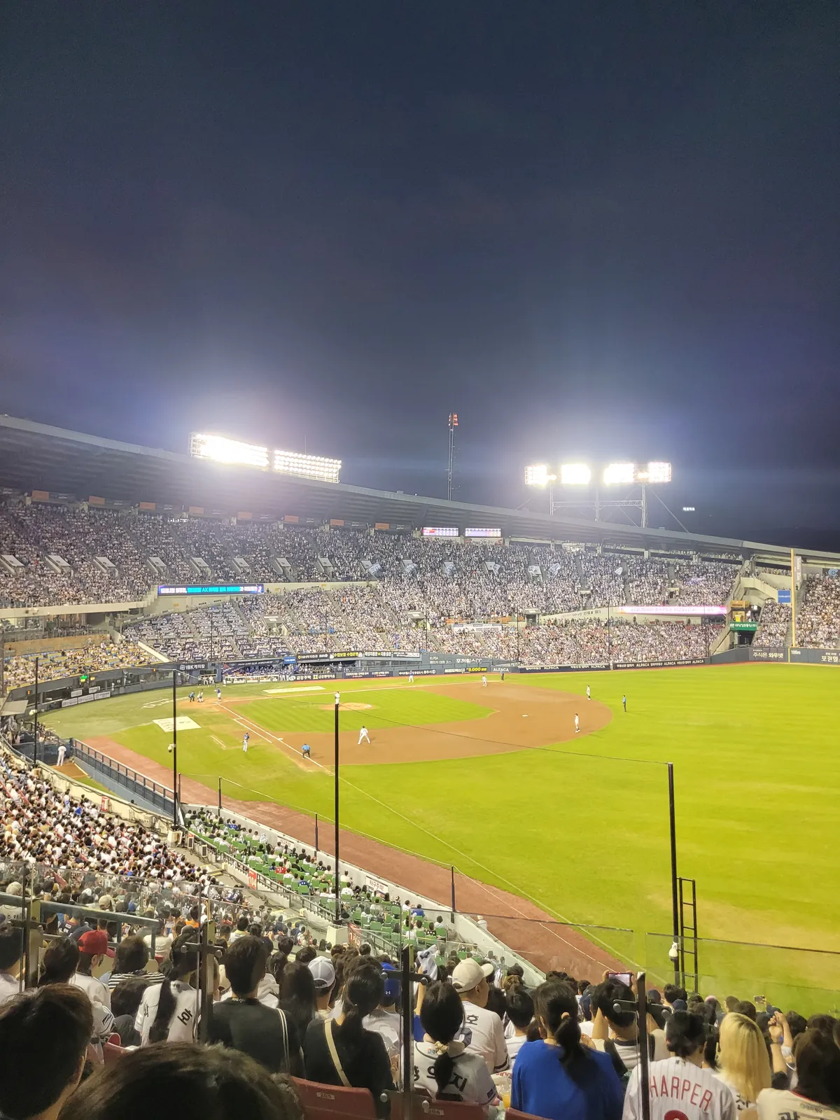 Jamsil Baseball Stadium field under the lights during a KBO night game