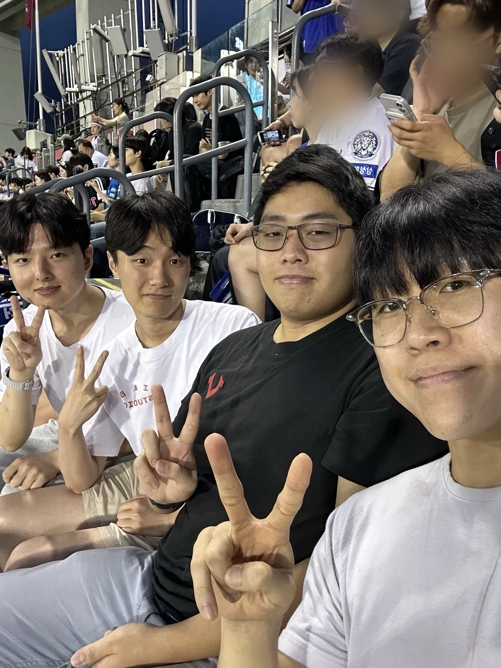 HanBuddy guests and buddies smiling together in the stands at Jamsil Baseball Stadium